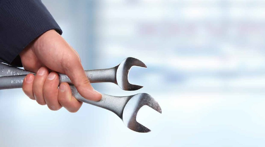 handyman holding wrenches